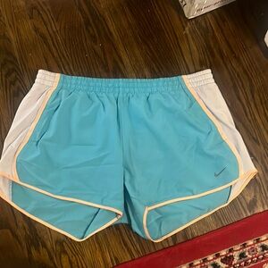 Nike running shorts in blue and orange. Size large
